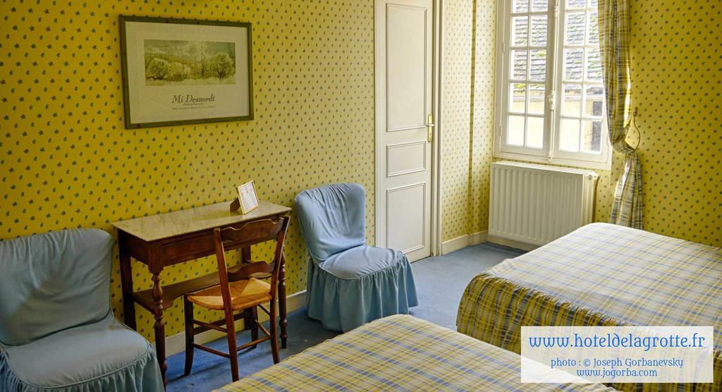 Hotel De La Grotte Монтиньяк Номер фото